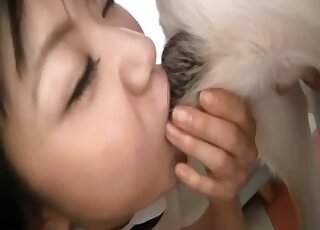 Cute Japanese model sucks her doggy dick